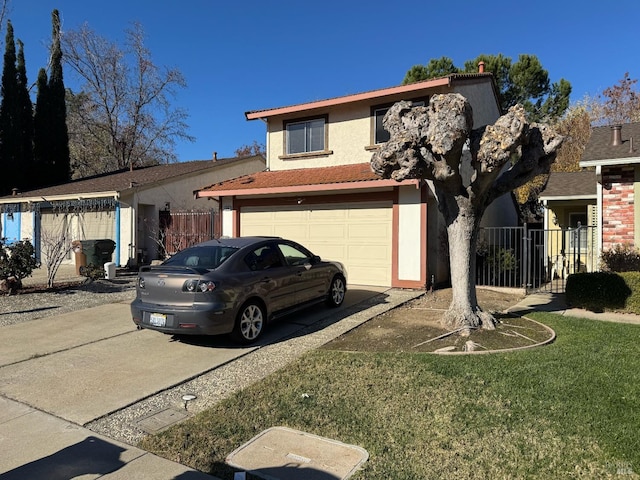 view of front of property featuring a front lawn and a garage