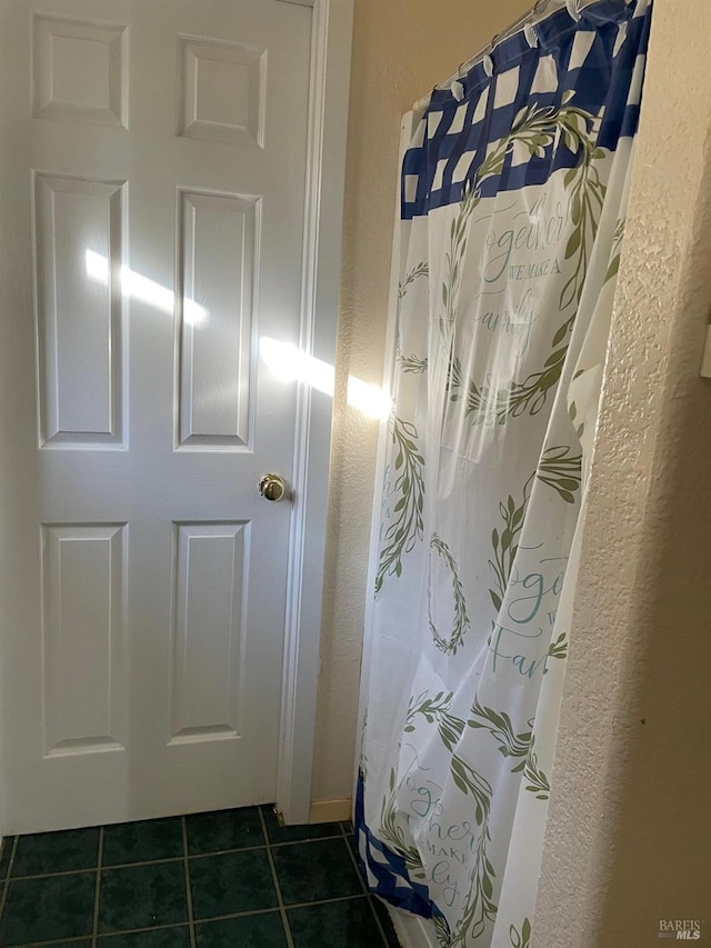 bathroom featuring tile patterned flooring