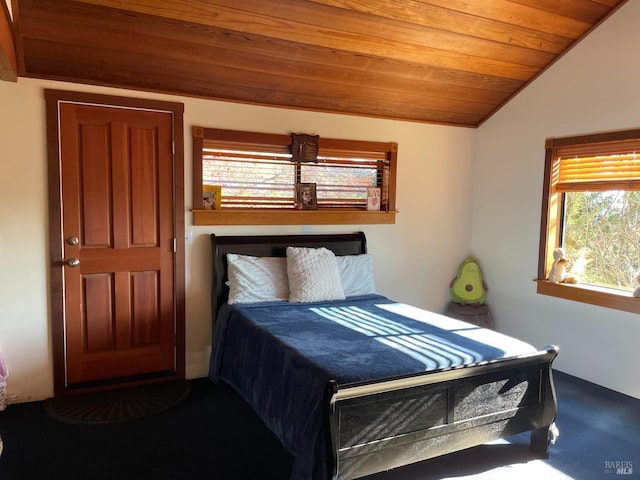 carpeted bedroom featuring wooden ceiling and lofted ceiling