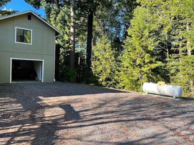 view of side of home featuring a garage