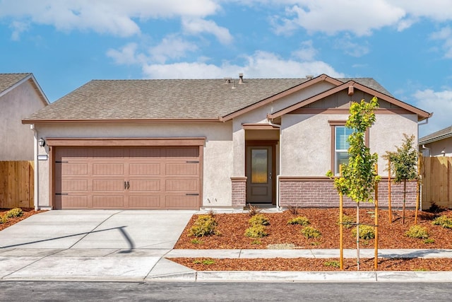 ranch-style house featuring a garage, a shingled roof, fence, driveway, and stucco siding