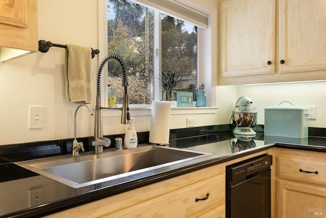 kitchen featuring dishwasher, light brown cabinets, and sink