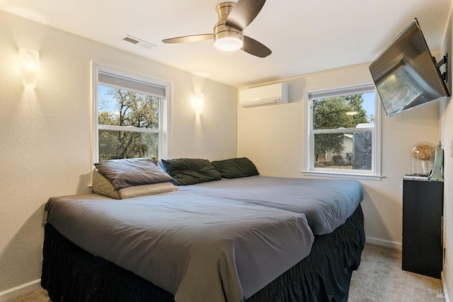 carpeted bedroom featuring multiple windows, an AC wall unit, and ceiling fan