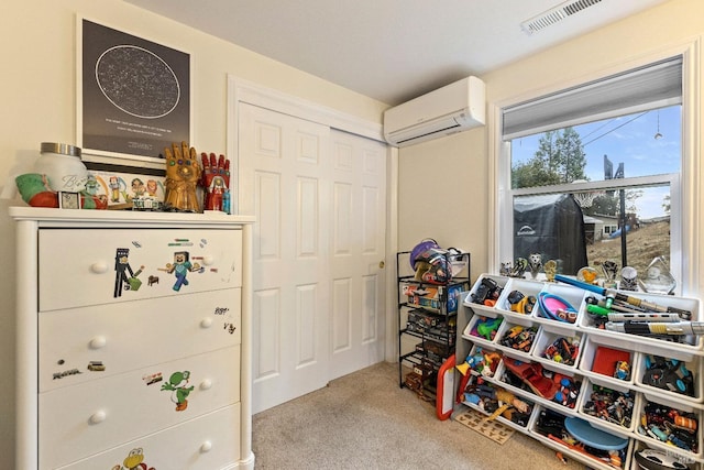 recreation room featuring carpet floors and a wall mounted AC