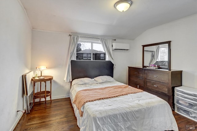 bedroom with lofted ceiling, dark wood-type flooring, and a wall unit AC