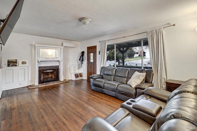 living room with dark hardwood / wood-style flooring, an AC wall unit, and crown molding