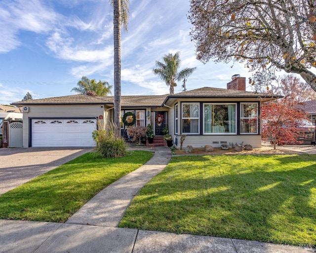 ranch-style home with a garage, driveway, a front lawn, and a chimney