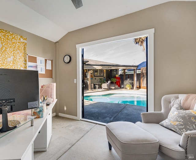interior space with lofted ceiling and baseboards