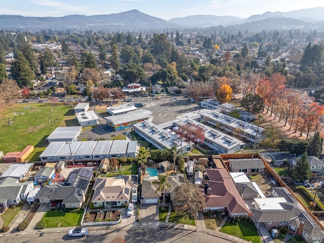 birds eye view of property with a residential view and a mountain view