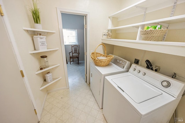 laundry room with independent washer and dryer