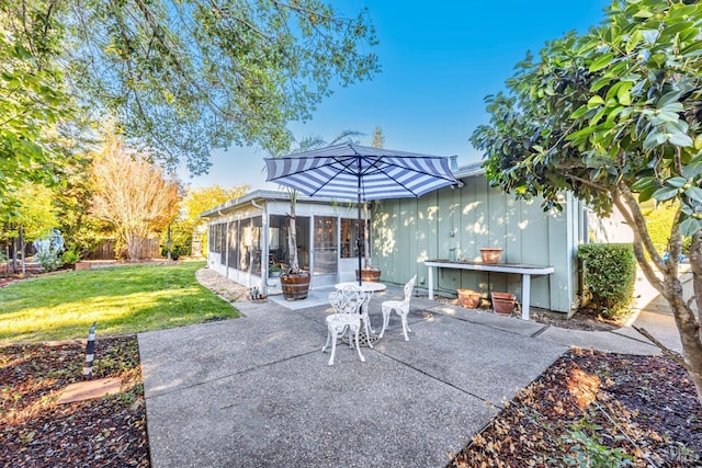 view of patio / terrace with a sunroom