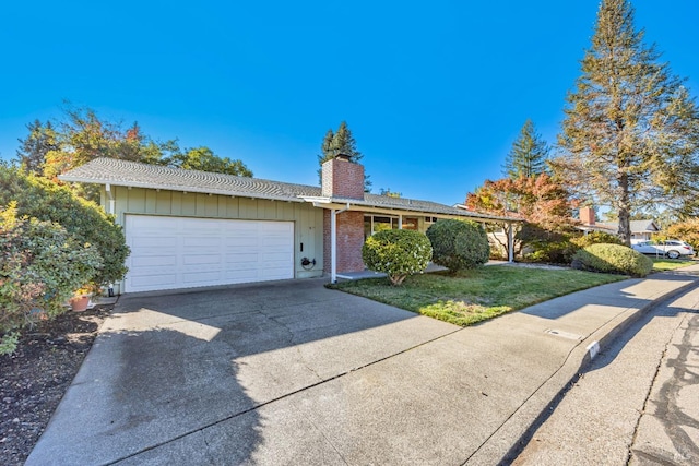 single story home featuring a garage and a front lawn