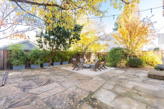 view of patio / terrace with an outdoor fire pit