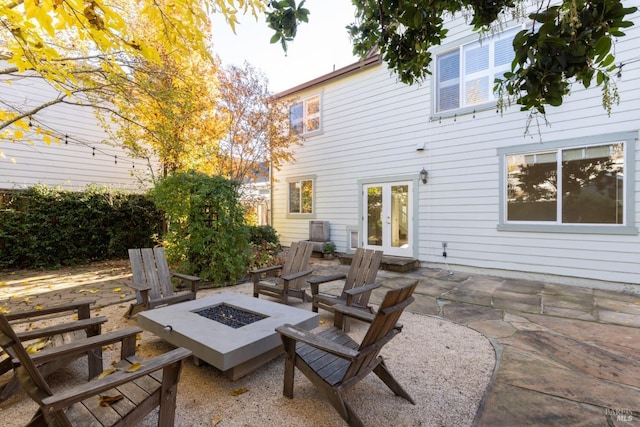 view of patio with a fire pit and french doors