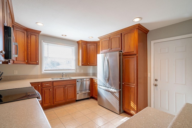 kitchen featuring sink, light tile patterned floors, and stainless steel appliances