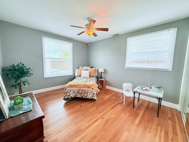 living area featuring ceiling fan and light wood-type flooring