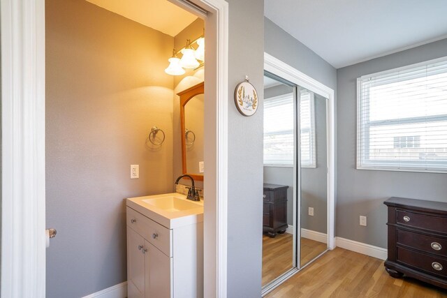 bathroom featuring vanity and hardwood / wood-style flooring