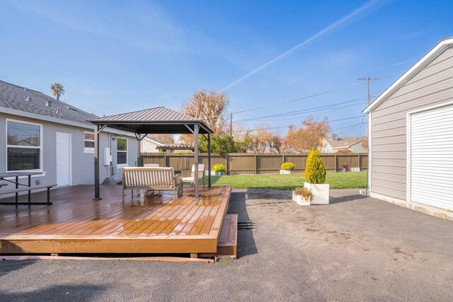 wooden terrace featuring a gazebo and an outdoor hangout area