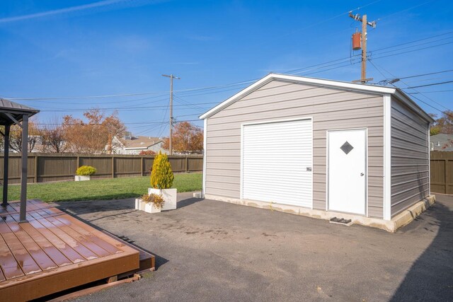 garage featuring a lawn