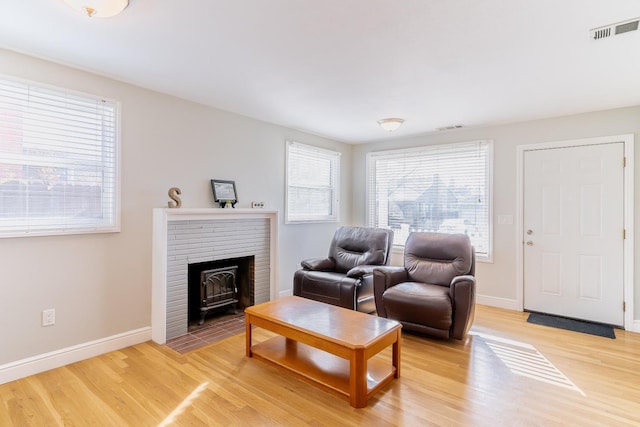 living room with wood-type flooring and plenty of natural light