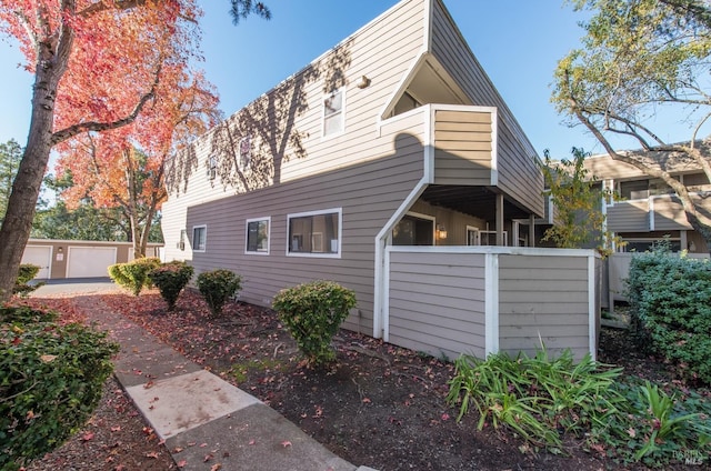 view of property exterior featuring an outbuilding