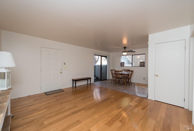 entryway with light hardwood / wood-style floors and ceiling fan