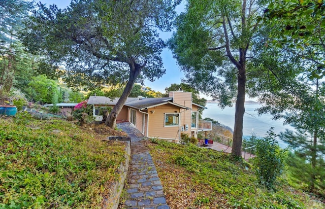 view of front of home featuring a water view