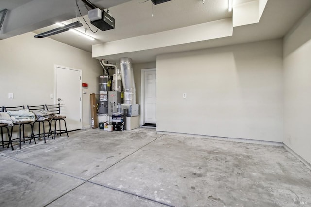 garage with secured water heater and a garage door opener