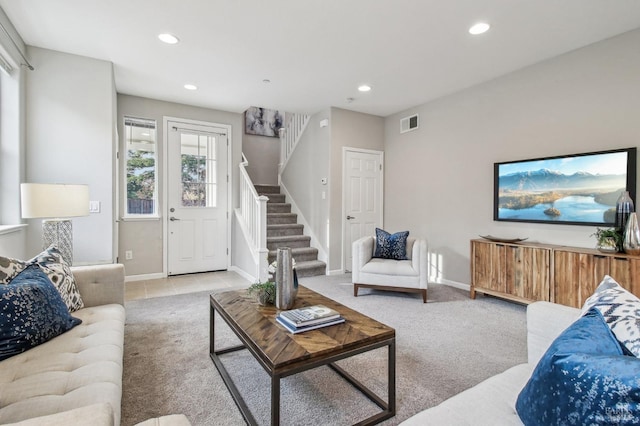 living room featuring light carpet