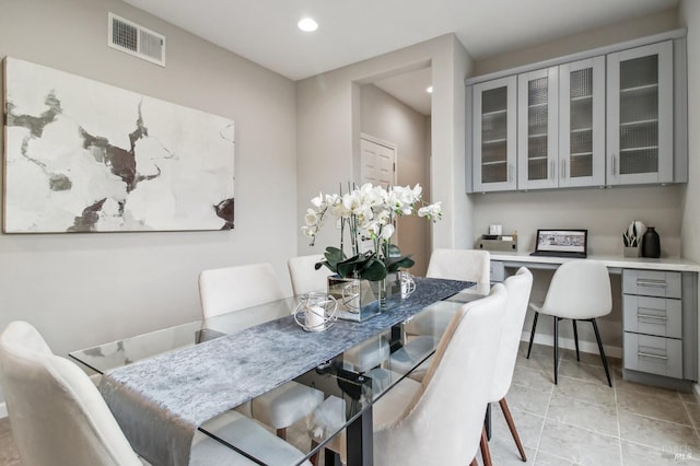 dining space with light tile patterned floors