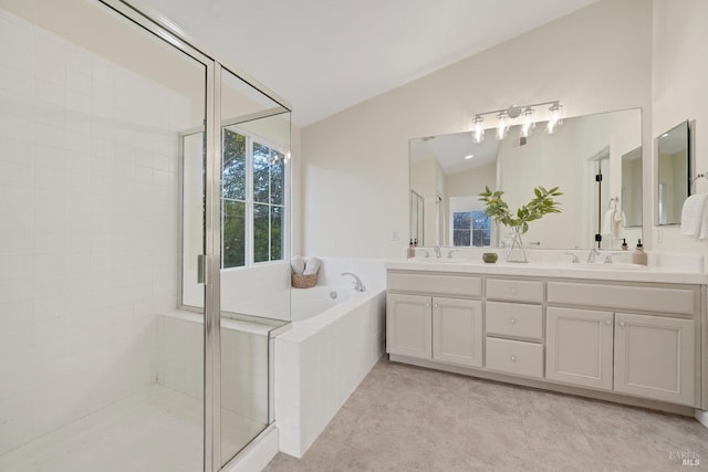 full bathroom featuring lofted ceiling, a garden tub, a sink, and a shower stall