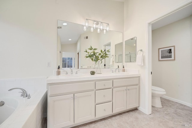 full bathroom with a bath, a sink, toilet, and double vanity