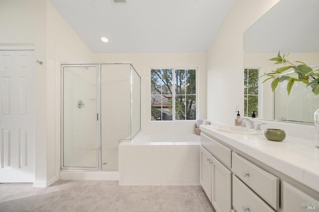 full bath featuring lofted ceiling, a garden tub, tile patterned flooring, vanity, and a stall shower