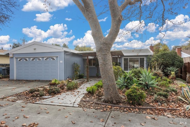 ranch-style home featuring a garage