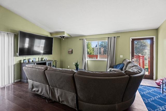 living room with hardwood / wood-style floors and lofted ceiling