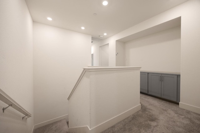 corridor with baseboards, carpet flooring, and recessed lighting