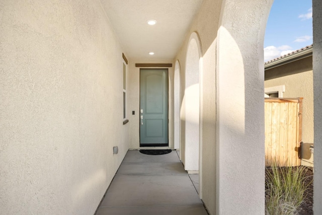 view of exterior entry with stucco siding
