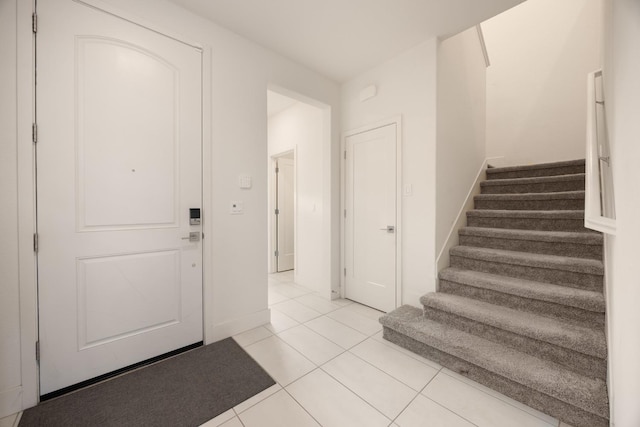 entrance foyer with light tile patterned flooring