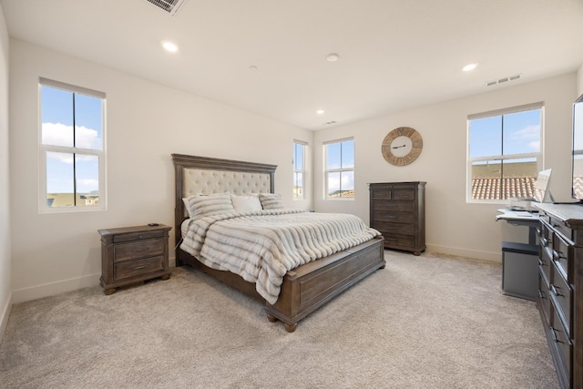 bedroom with recessed lighting, visible vents, baseboards, and light colored carpet