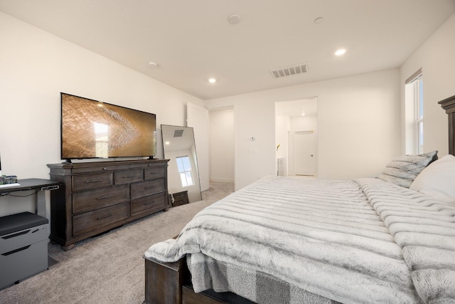 bedroom featuring recessed lighting, visible vents, light colored carpet, and multiple windows