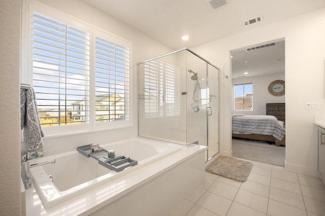 full bathroom featuring ensuite bath, tile patterned flooring, a garden tub, and visible vents