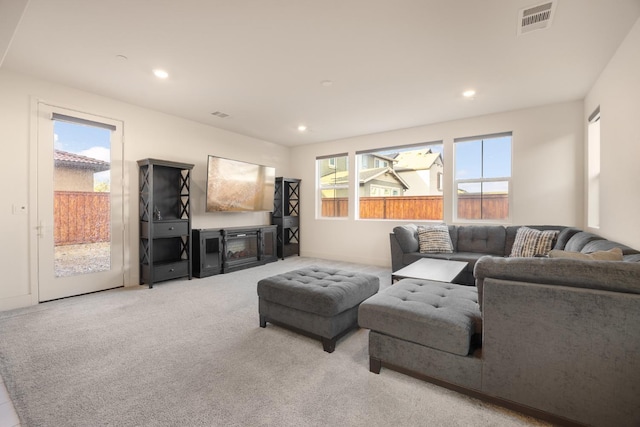 carpeted living room featuring recessed lighting and visible vents