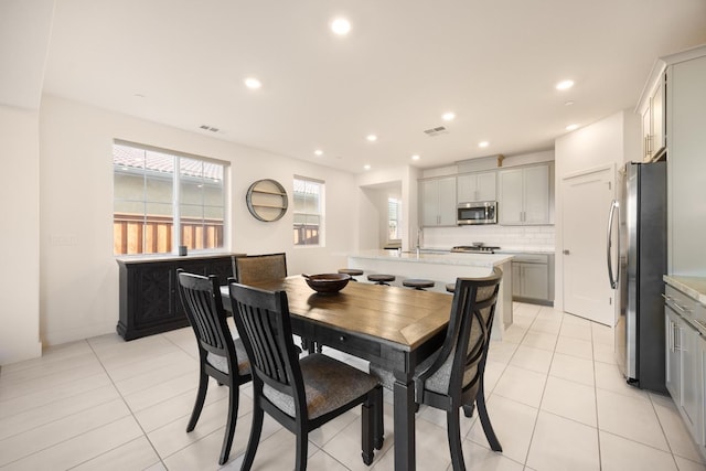 dining space featuring recessed lighting, visible vents, and light tile patterned floors