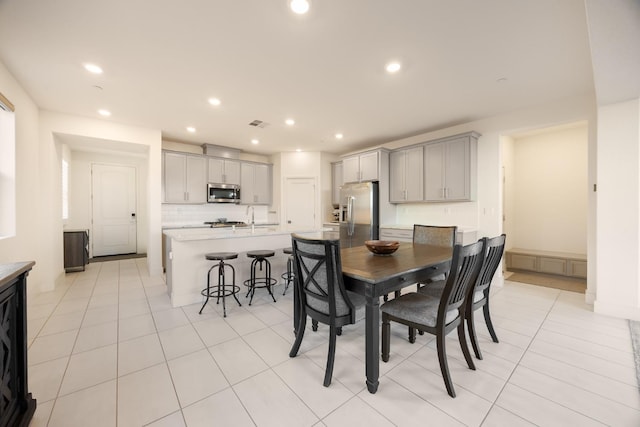 dining room with recessed lighting, visible vents, and light tile patterned floors