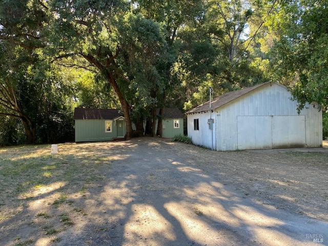 exterior space with a shed