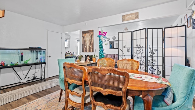 dining room with hardwood / wood-style floors