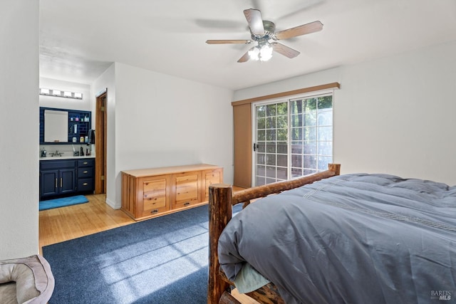 bedroom with light carpet, ceiling fan, and ensuite bathroom