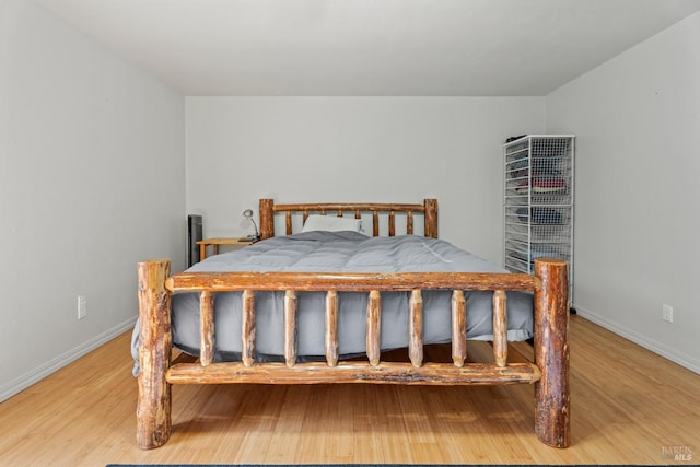 bedroom with light wood-type flooring