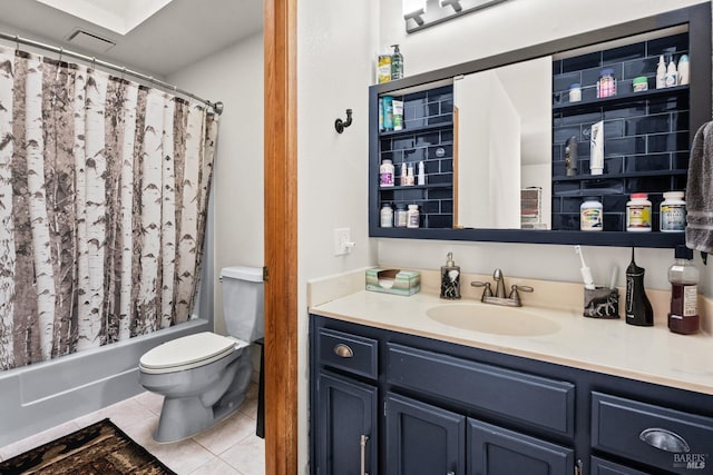 full bathroom featuring tile patterned flooring, vanity, toilet, and shower / tub combo with curtain