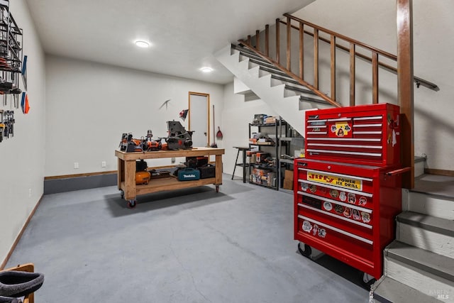 interior space featuring concrete flooring and a workshop area